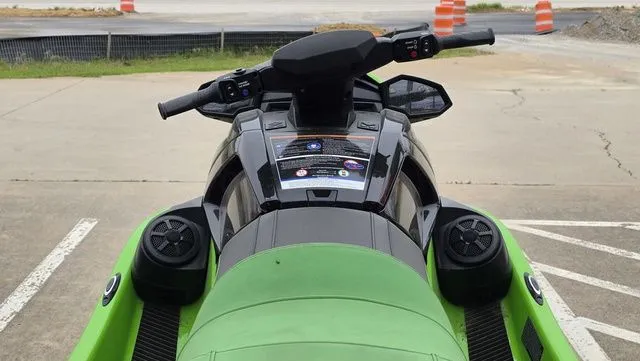 Slide: The Image of 2021 Yamaha WaveRunner VX1800B-WB, green, parked on pavement. - 9