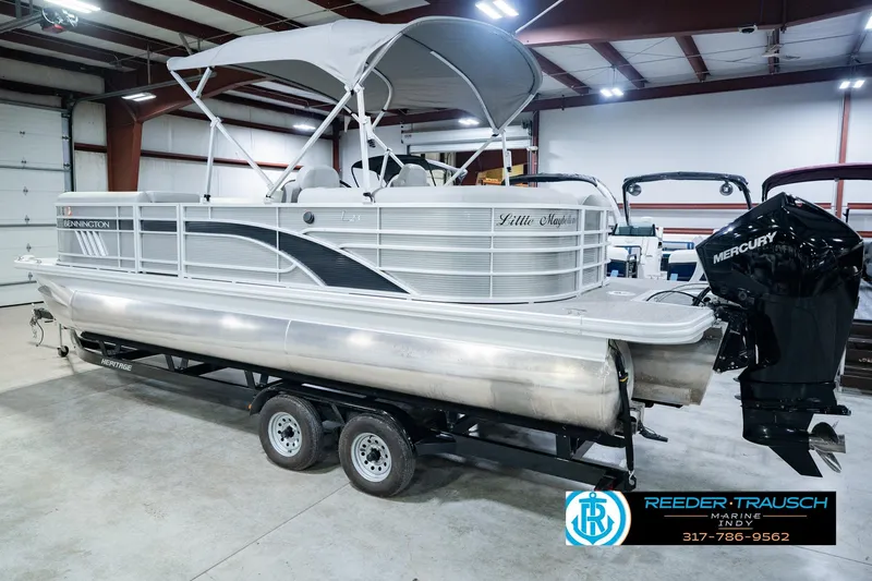 Slide: The Image of 2023 Bennington 23 LSR pontoon boat with Mercury engine in a showroom. - 10