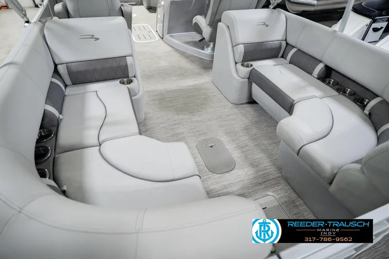 Slide: The Image of Luxurious interior of 2023 Bennington 23 LSR pontoon boat with plush seating and cup holders. - 17