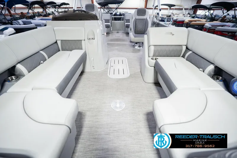 Slide: The Image of 2023 Bennington 23 LSR pontoon boat interior with luxurious seating and modern design. - 18