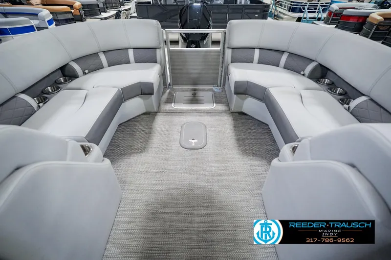 Slide: The Image of Interior of 2023 Bennington 23 LSR pontoon boat with gray seating and carpet. - 21
