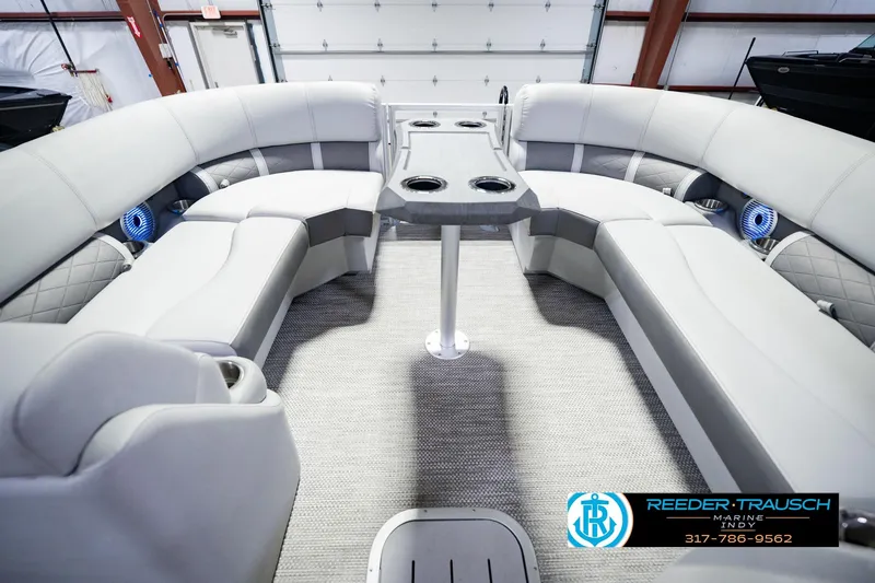 Slide: The Image of Luxurious interior of 2023 Bennington 23 LSR pontoon boat with plush seating and table. - 28