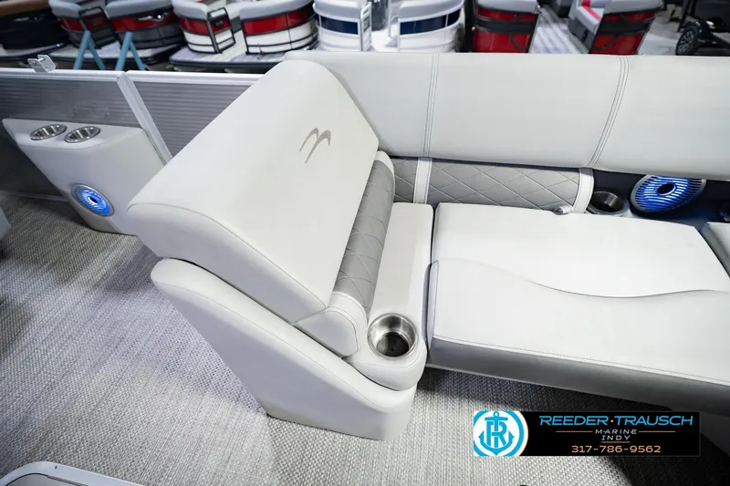 Slide: The Image of 2023 Bennington 23 LSR boat interior with luxurious seating and cup holders. - 29