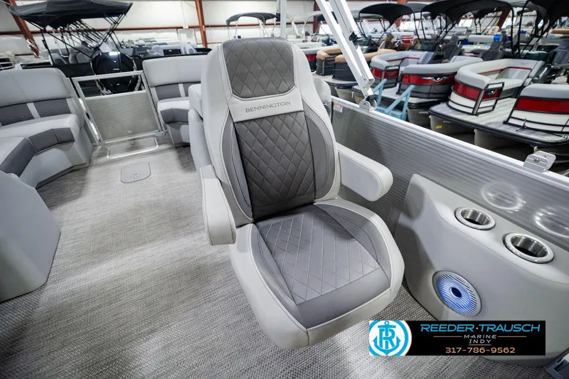Slide: The Image of 2023 Bennington 23 LSR boat interior with plush seating and cup holders. - 33