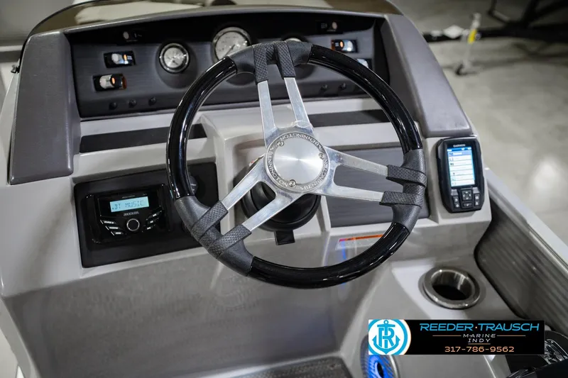 Slide: The Image of Steering console of 2023 Bennington 23 LSR boat with modern controls and gauges. - 37