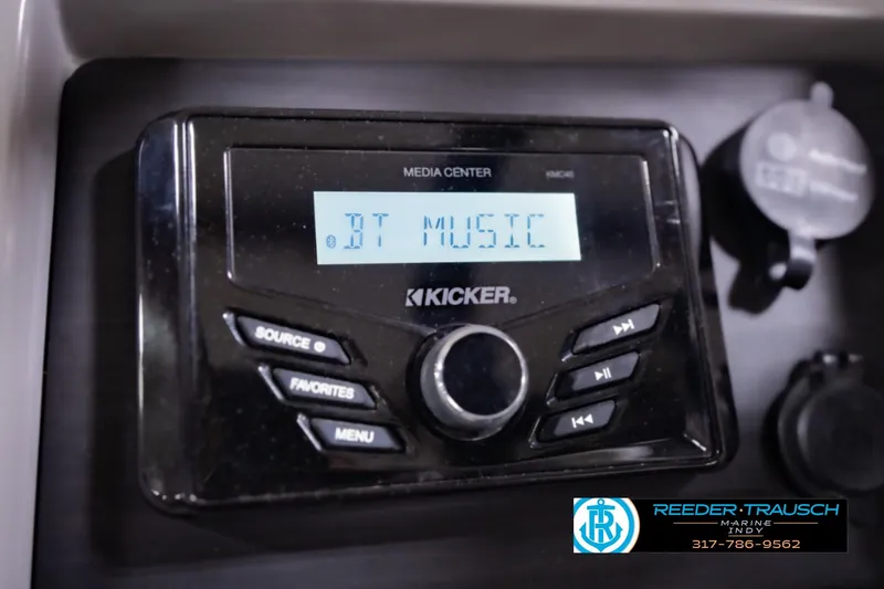 Slide: The Image of Kicker media center displaying "BT Music" in a 2023 Bennington 23 LSR boat. - 39