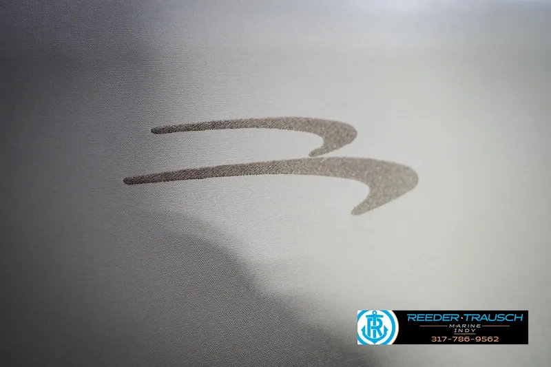 Slide: The Image of 2023 Bennington 23 LSR logo on a sleek metallic surface. - 49