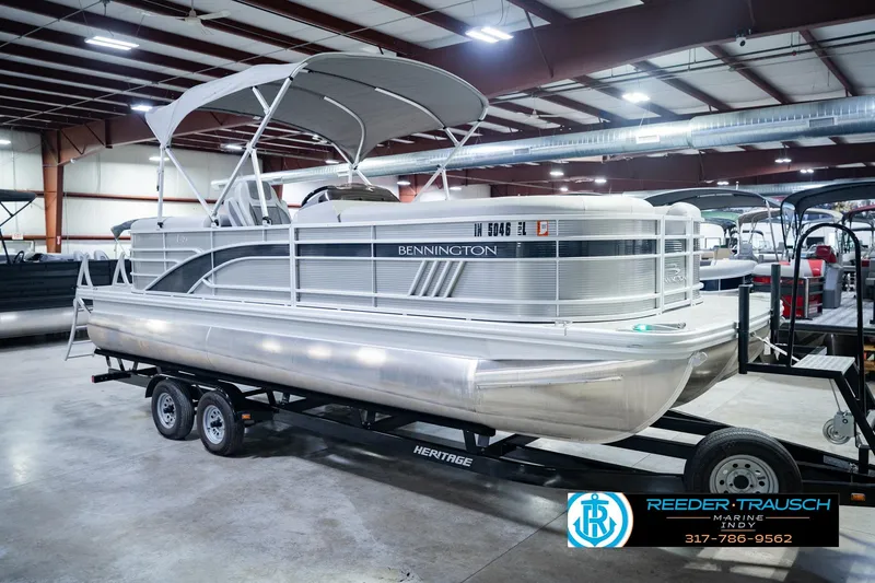 Slide: The Image of 2023 Bennington 23 LSR pontoon boat on trailer in indoor showroom. - 5