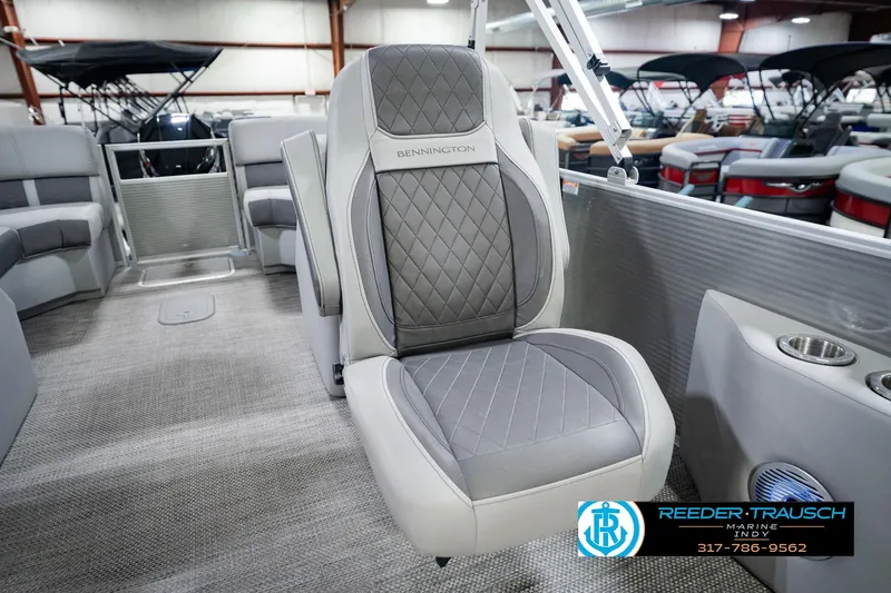 Slide: The Image of 2023 Bennington 23 LSR boat interior with gray quilted seating and cup holders. - 50