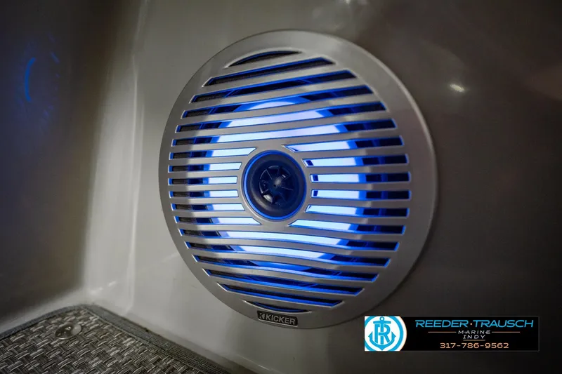 Slide: The Image of Illuminated speaker on 2023 Bennington 23 LSR boat, featuring blue LED lighting. - 53