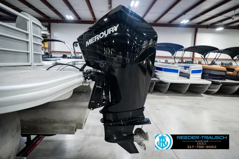 Slide: The Image of 2023 Bennington 23 LSR pontoon boat with Mercury outboard motor in showroom. - 56