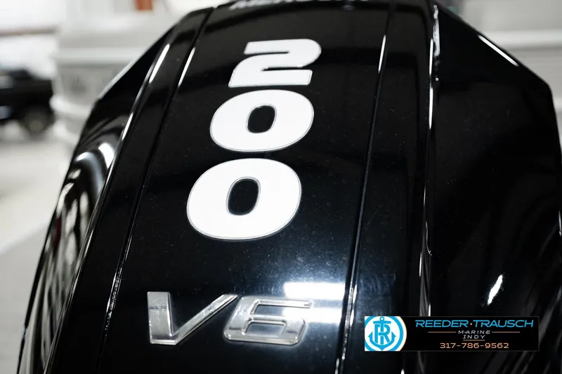 Slide: The Image of Close-up of a 2023 Bennington 23 LSR V6 engine with "200" marking. - 58