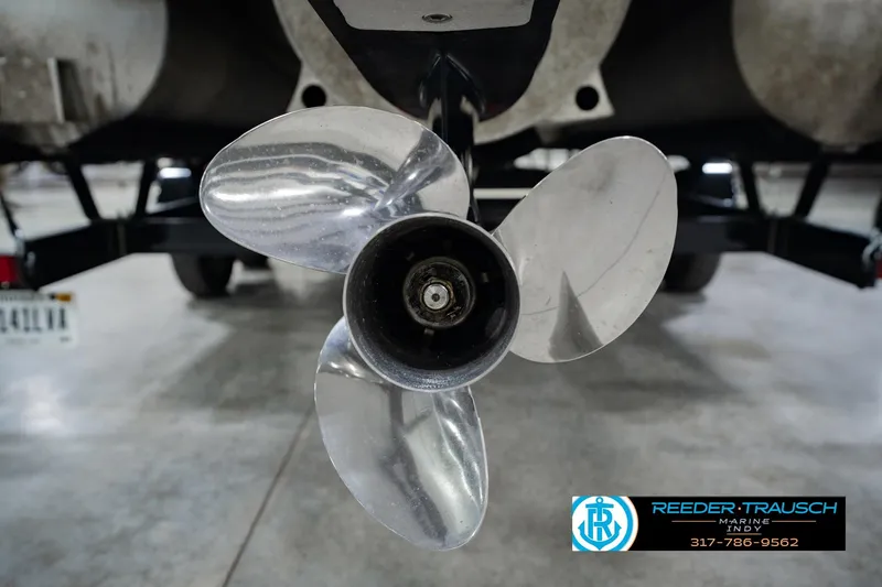 Slide: The Image of Close-up of a 2023 Bennington 23 LSR boat propeller in a showroom. - 59