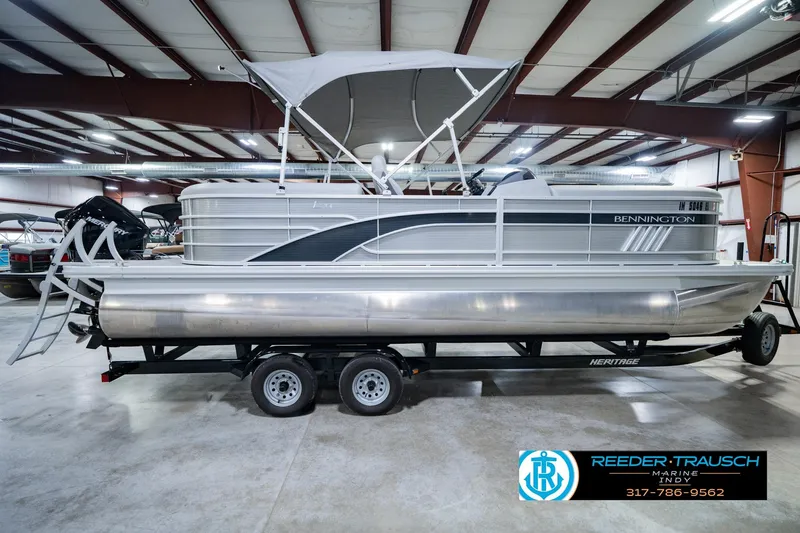 Slide: The Image of 2023 Bennington 23 LSR pontoon boat on trailer in indoor showroom. - 6