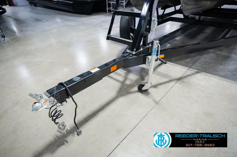 Slide: The Image of Trailer hitch of a 2023 Bennington 23 LSR boat, displayed indoors at Reeder Trausch Marine. - 62