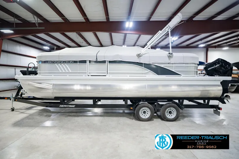 Slide: The Image of 2023 Bennington 23 LSR pontoon boat on trailer in indoor showroom. - 66