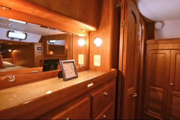 Slide: The Image of Luxurious wooden interior of 2012 Passport Vista 545 Center Cockpit yacht cabin. - 13