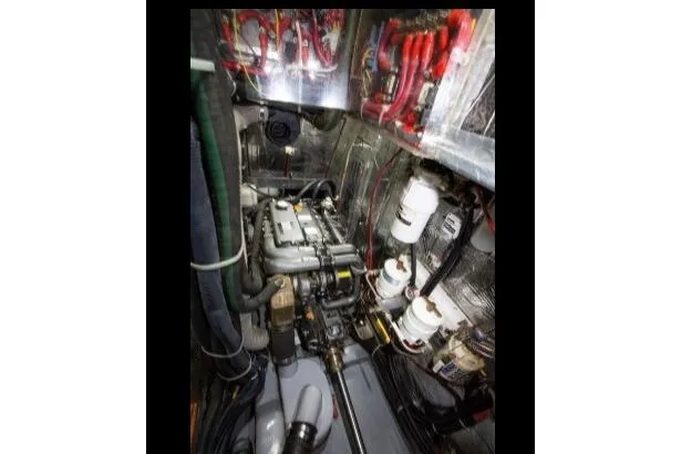 Slide: The Image of Engine room of 2012 Passport Vista 545 Center Cockpit yacht, showcasing mechanical components. - 15
