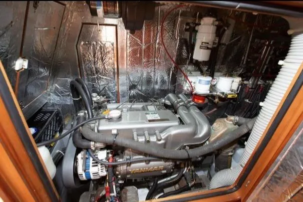 Slide: The Image of Engine room of 2012 Passport Vista 545 Center Cockpit yacht, showcasing mechanical components. - 16