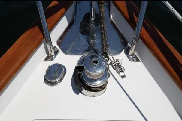 Slide: The Image of Anchor windlass on 2012 Passport Vista 545 Center Cockpit sailboat deck. - 17