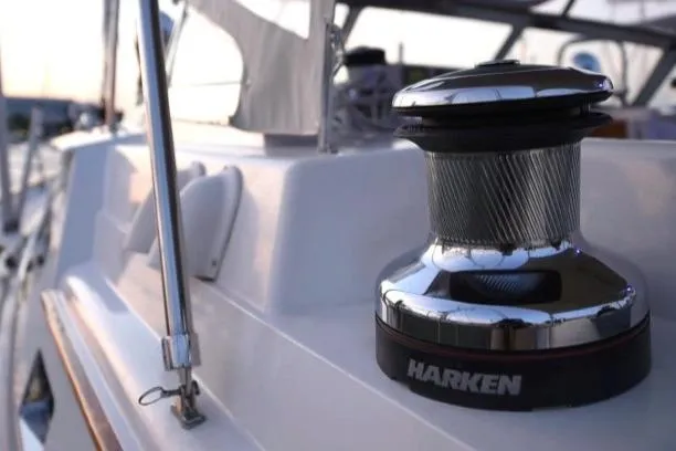 Slide: The Image of Winch on 2012 Passport Vista 545 Center Cockpit sailboat deck at sunset. - 20