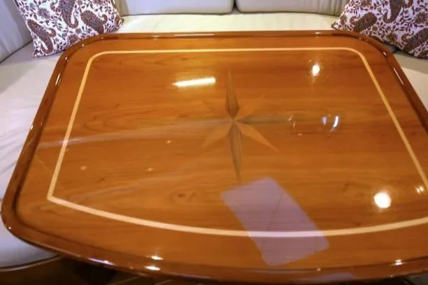 Slide: The Image of Polished wooden table with star inlay on Passport Vista 545 Center Cockpit, 2012 model. - 5