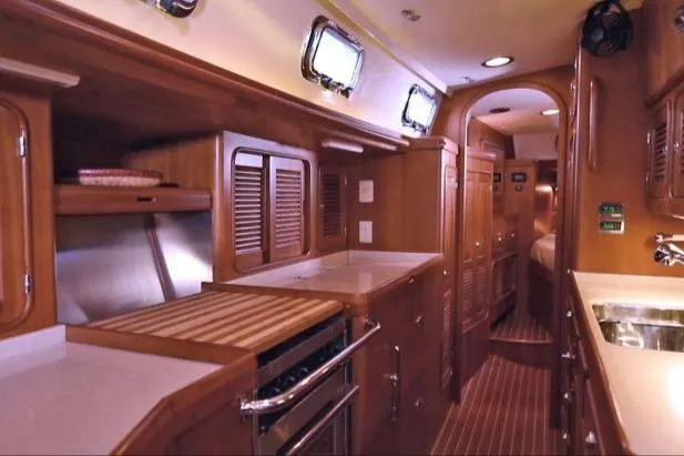 Slide: The Image of Luxurious interior of 2012 Passport Vista 545 Center Cockpit yacht with wooden cabinetry. - 8