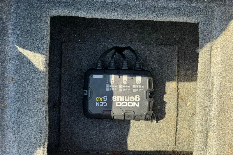 Slide: The Image of NOCO Genius GEN5X3 charger installed in 2024 Tracker Pro Team 175 TXW boat compartment. - 19