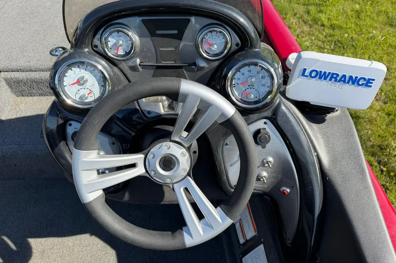 Slide: The Image of 2024 Tracker Pro Team 175 TXW dashboard with steering wheel and Lowrance Hook display. - 9