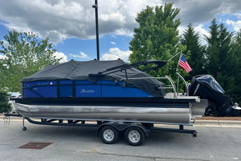 Slide: The Image of 2023 Barletta C22U pontoon boat on trailer with cover. - 5