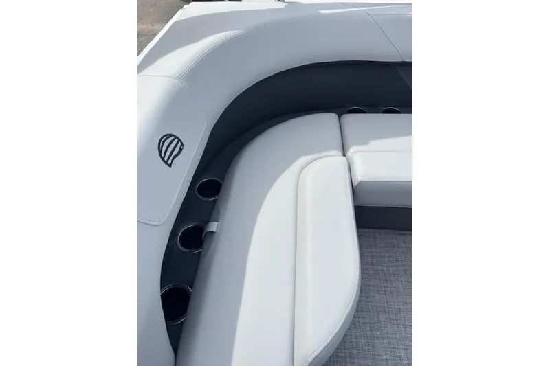 Slide: The Image of 2026 Sun Tracker Party Barge 16 DLX interior seating with cup holders. - 11