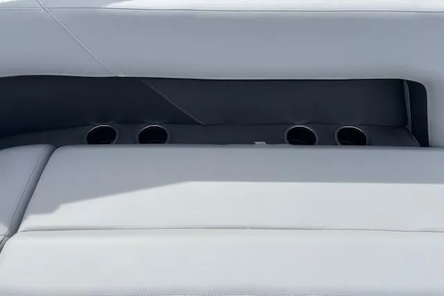 Slide: The Image of 2026 Sun Tracker Party Barge 16 DLX seating with integrated cup holders. - 12