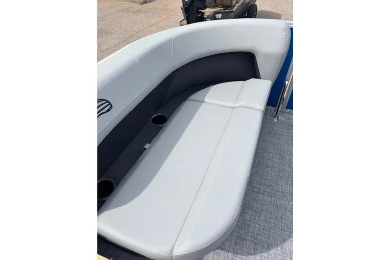 Slide: The Image of 2026 Sun Tracker Party Barge 16 DLX boat seating with cup holders and sleek design. - 13
