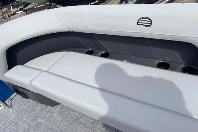 Slide: The Image of 2026 Sun Tracker Party Barge 16 DLX boat seating with cup holders and sleek design. - 14