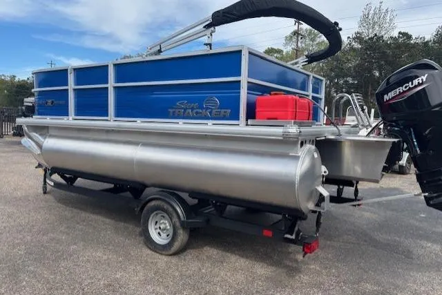Slide: The Image of 2026 Sun Tracker Party Barge 16 DLX pontoon boat with Mercury outboard motor on trailer. - 2