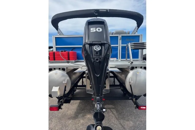 Slide: The Image of 2026 Sun Tracker Party Barge 16 DLX with Mercury 50 outboard motor, rear view. - 4