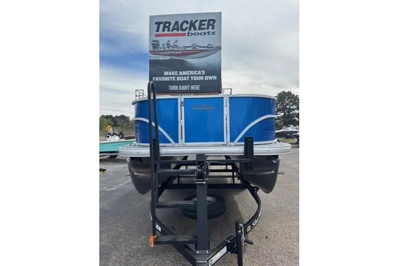 Slide: The Image of 2026 Sun Tracker Party Barge 16 DLX pontoon boat on trailer, displayed outdoors. - 6