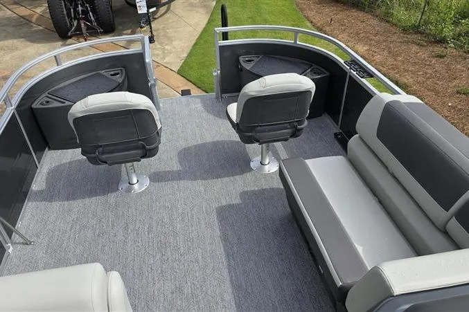 Slide: The Image of 2026 Sun Tracker Fishin' Barge 22 DLX interior with seating and fishing chairs. - 9