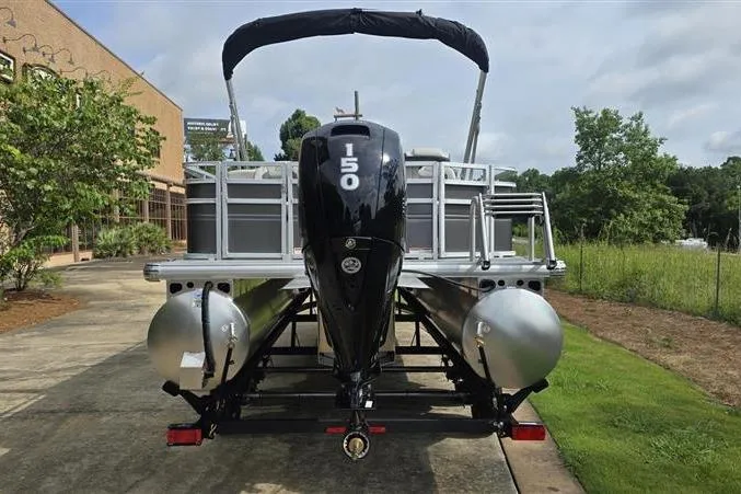 Slide: The Image of 2026 Sun Tracker Fishin' Barge 22 DLX pontoon boat with powerful 150 HP engine. - 3