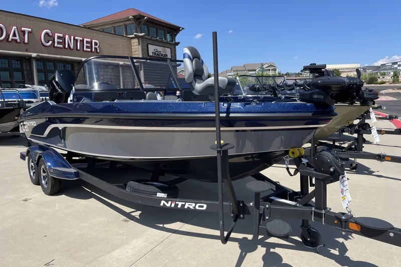 Slide: The Image of 2026 Nitro ZV21 Pro boat displayed at a dealership, featuring sleek design and modern equipment. - 2