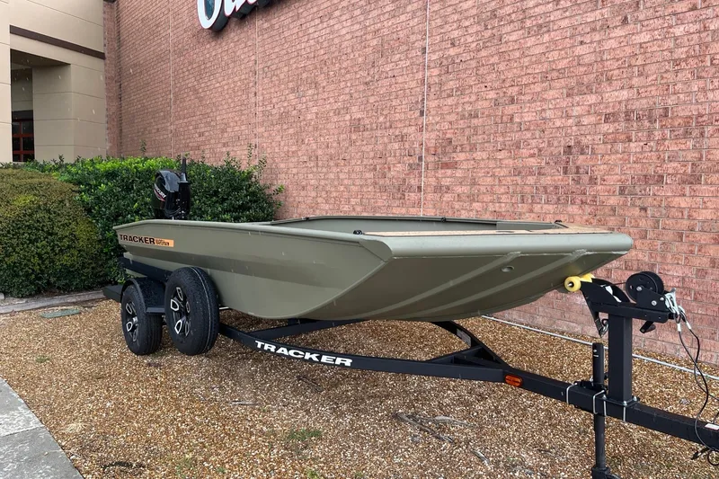 The Image of 2026 Tracker Grizzly 1756 T Marsh boat on trailer, parked outdoors. - 0