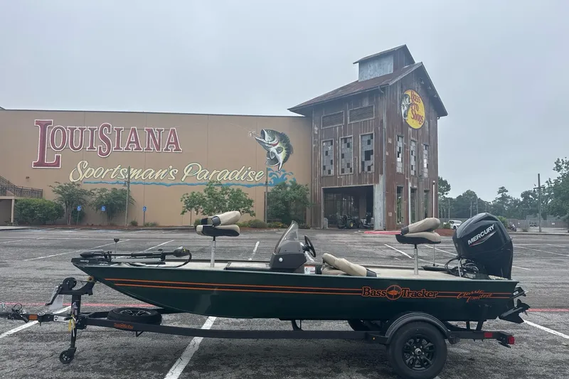 Slide: The Image of 2026 Tracker Bass Tracker Classic Limited boat outside Louisiana Bass Pro Shops. - 2