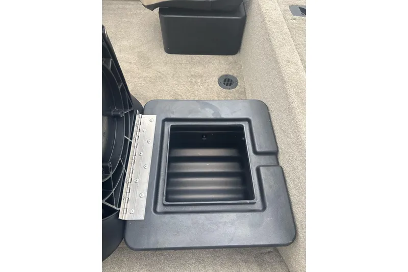 Slide: The Image of Open storage compartment in 2026 Tracker Bass Tracker Classic Limited boat. - 7