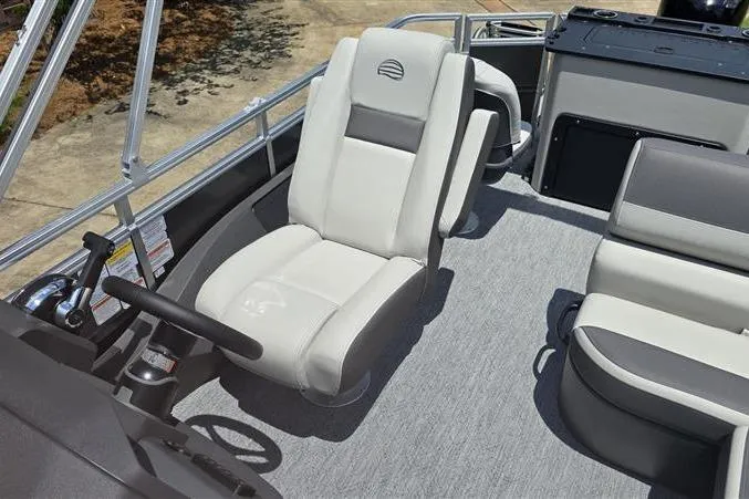 Slide: The Image of 2026 Sun Tracker Fishin' Barge 20 DLX interior with comfortable seating and modern design. - 12