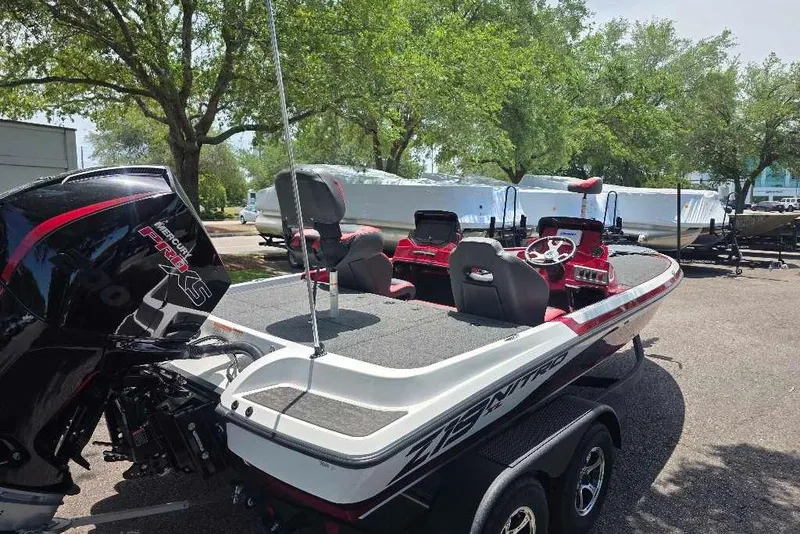 Slide: The Image of 2026 Nitro Z19 XL boat with Mercury Pro XS engine, parked outdoors. - 5