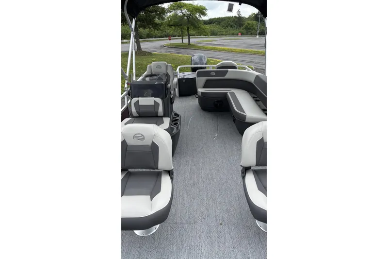 Slide: The Image of 2026 Sun Tracker Bass Buggy 18 DLX pontoon boat interior with gray seating and open layout. - 3