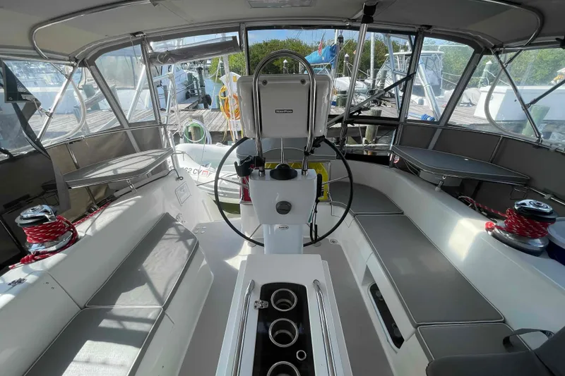 Slide: The Image of Cockpit of 2013 Catalina Morgan 440 sailboat with steering wheel and seating. - 1
