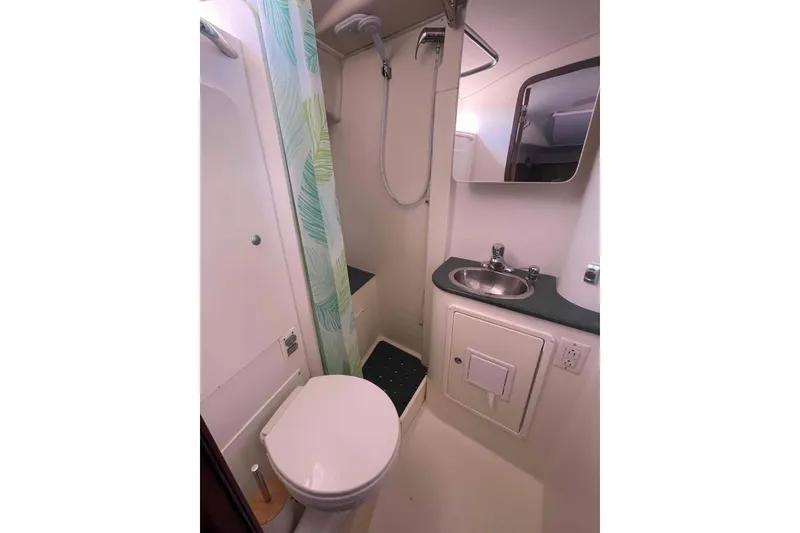 Slide: The Image of Compact bathroom in 2013 Catalina Morgan 440 yacht with shower, sink, and toilet. - 17