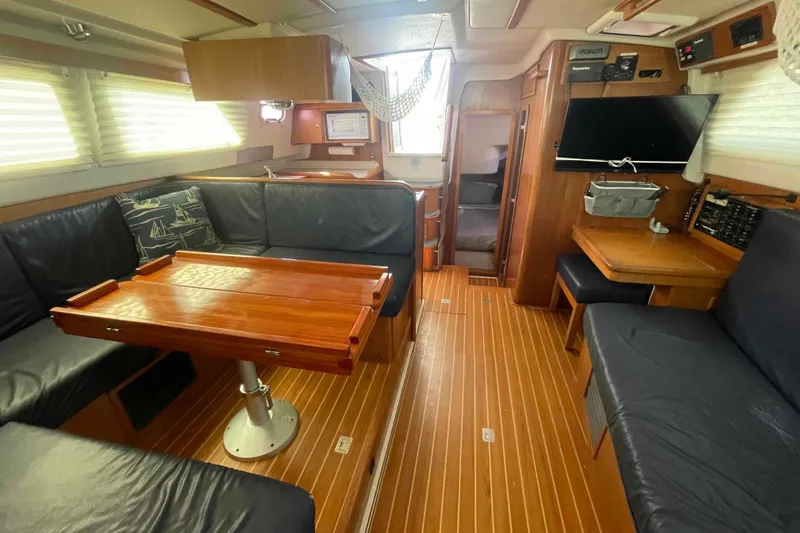 Slide: The Image of Interior of 2013 Catalina Morgan 440 yacht with wood flooring and leather seating. - 18