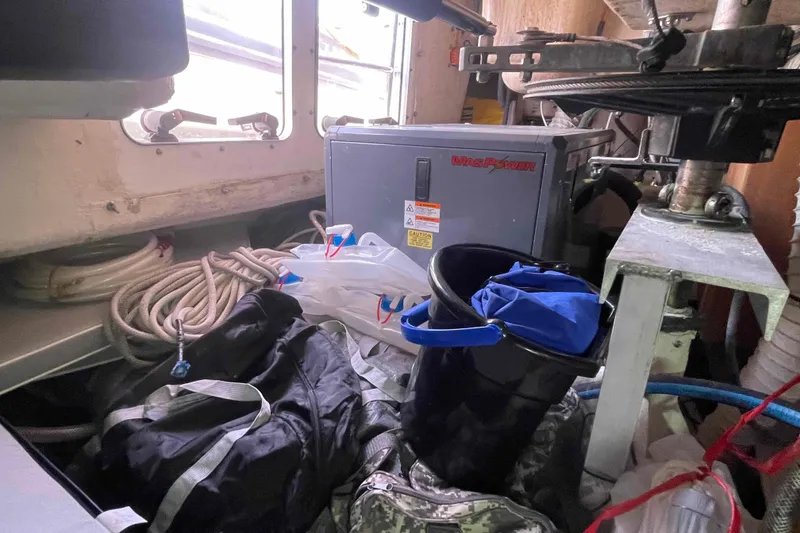 Slide: The Image of Interior of a 2013 Catalina Morgan 440 sailboat with equipment and storage items. - 26